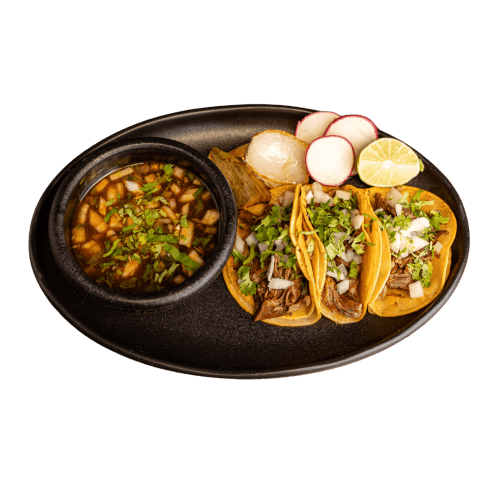 Birria tacos with onion and cilantro.